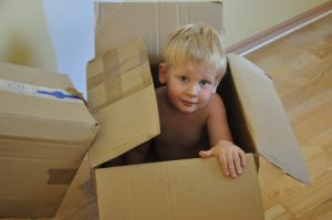 a cheerful child in a box