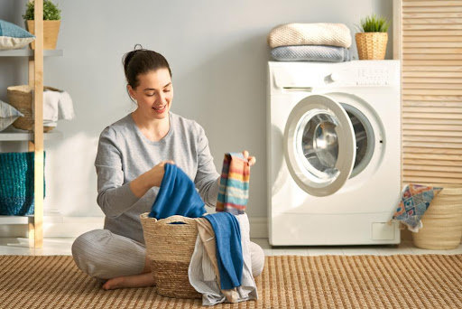 a woman sorting clothes to wash