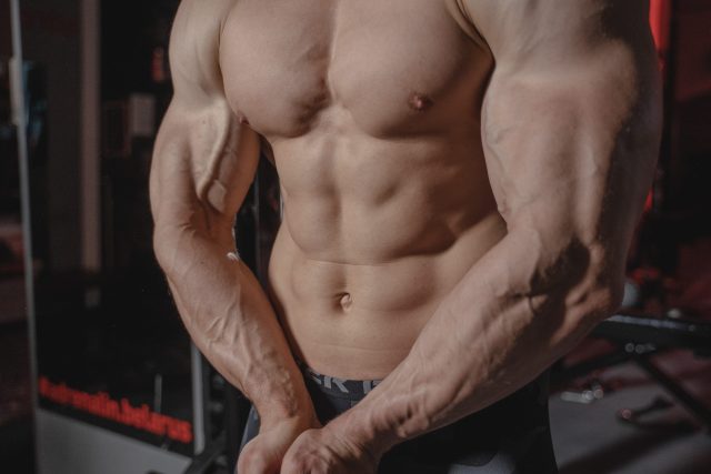 healthy guy flexing biceps