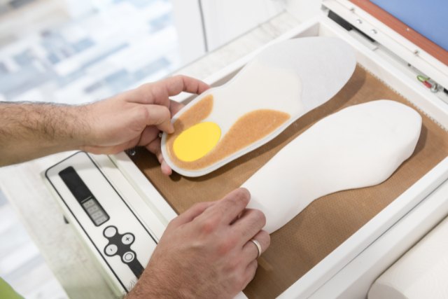 a podiatrist making foot orthotics
