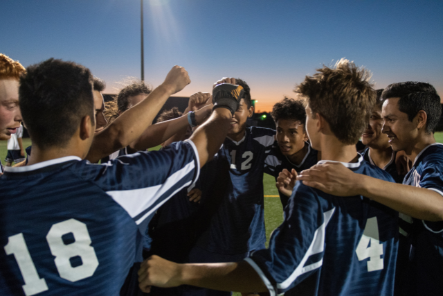Soccer team in a huddle