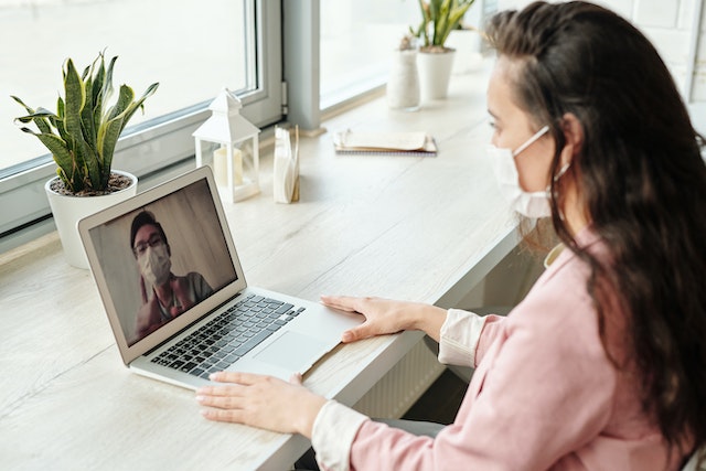 public health worker talking to a patient online
