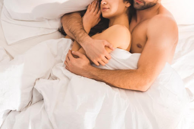 a couple sleeping in the nude