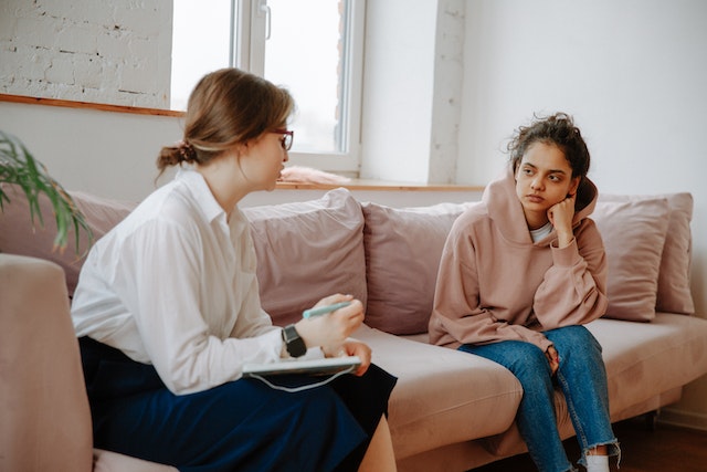 a healthcare professional talking to a patient