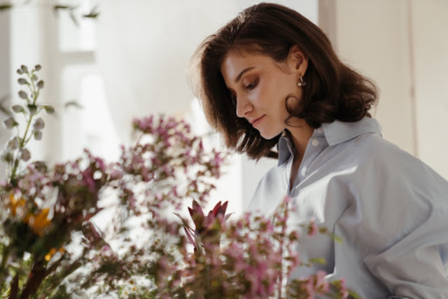 a fine lady choosing diff types of herbs for relaxation