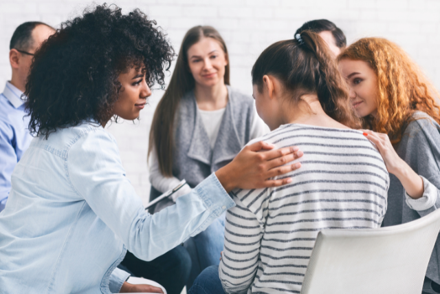 therapist and recovering addicts in a meeting