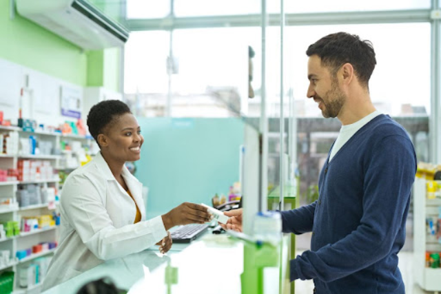 pharmacist helping a patient - featured image