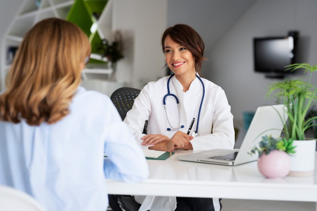 Female doctor consulting with her patient at the doctor's office
